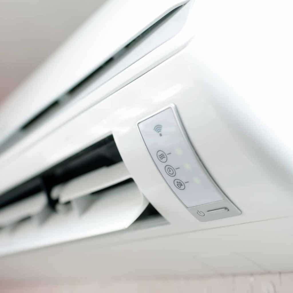 AC mistake #4: Close-up of a mini-split AC's air vents. Blocking these with furniture or drapes can reduce airflow and system efficiency."